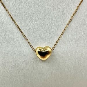 Gold tone heart pendant necklace